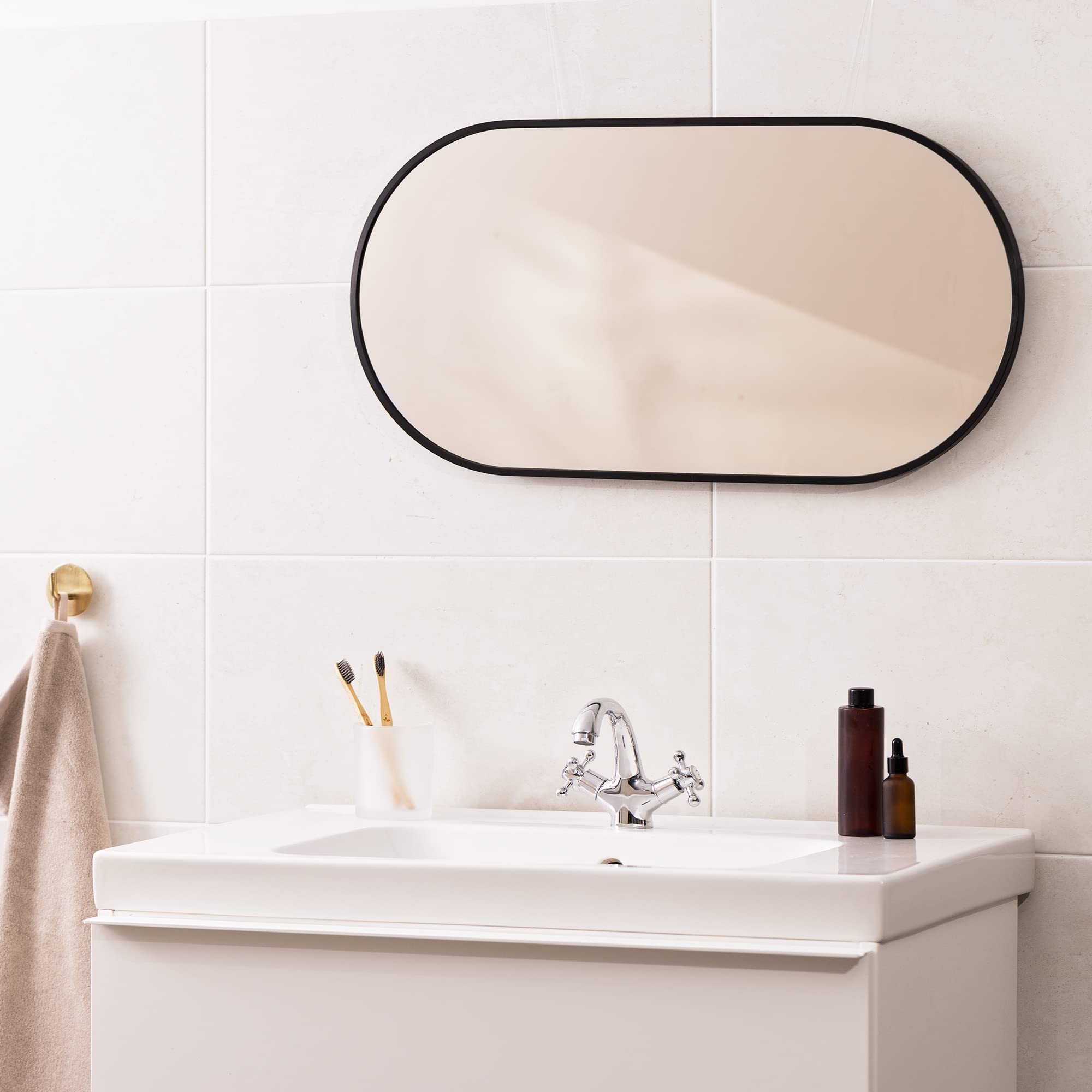 Navaris Oval Wall Mirror - 75 x 38 x 3 cm - Wall Mounted Hanging Mirror with Black Rustproof Aluminium Frame - Mirror for Bathroom Bedroom Hallway