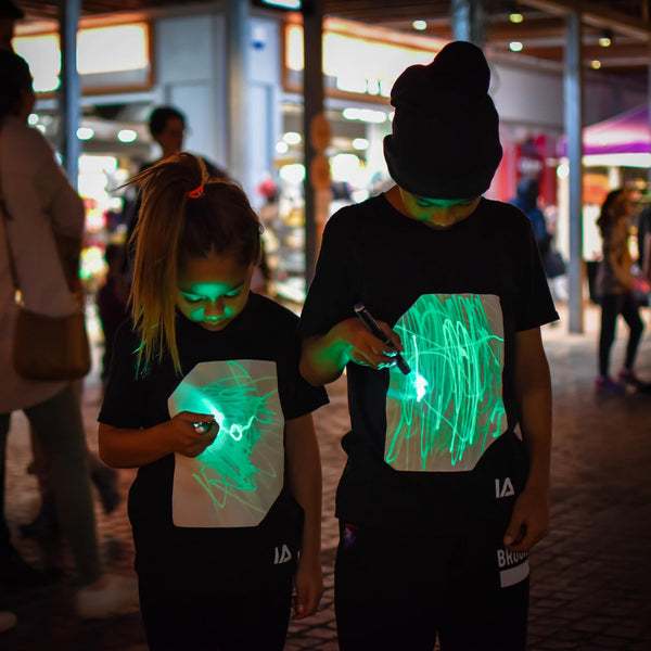 Illuminated Apparel Interactive Glow in The Dark T-Shirt - Fun for Birthday Parties & Festivals - Light up The Night