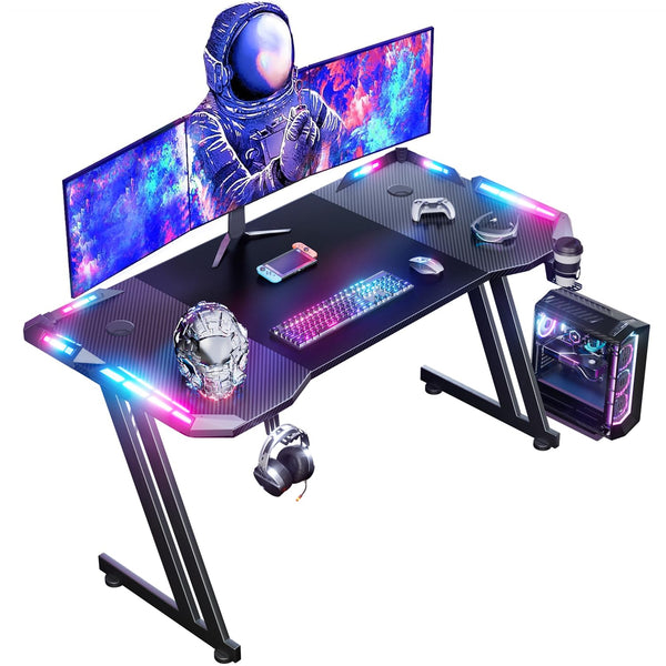DLONGONE 120 x 60cm RGB Gaming Desk, Large Gaming Table for Laptop, Home Office Desk with Carbon Fiber Coated, Gaming PC Desk with Headphone Hook and