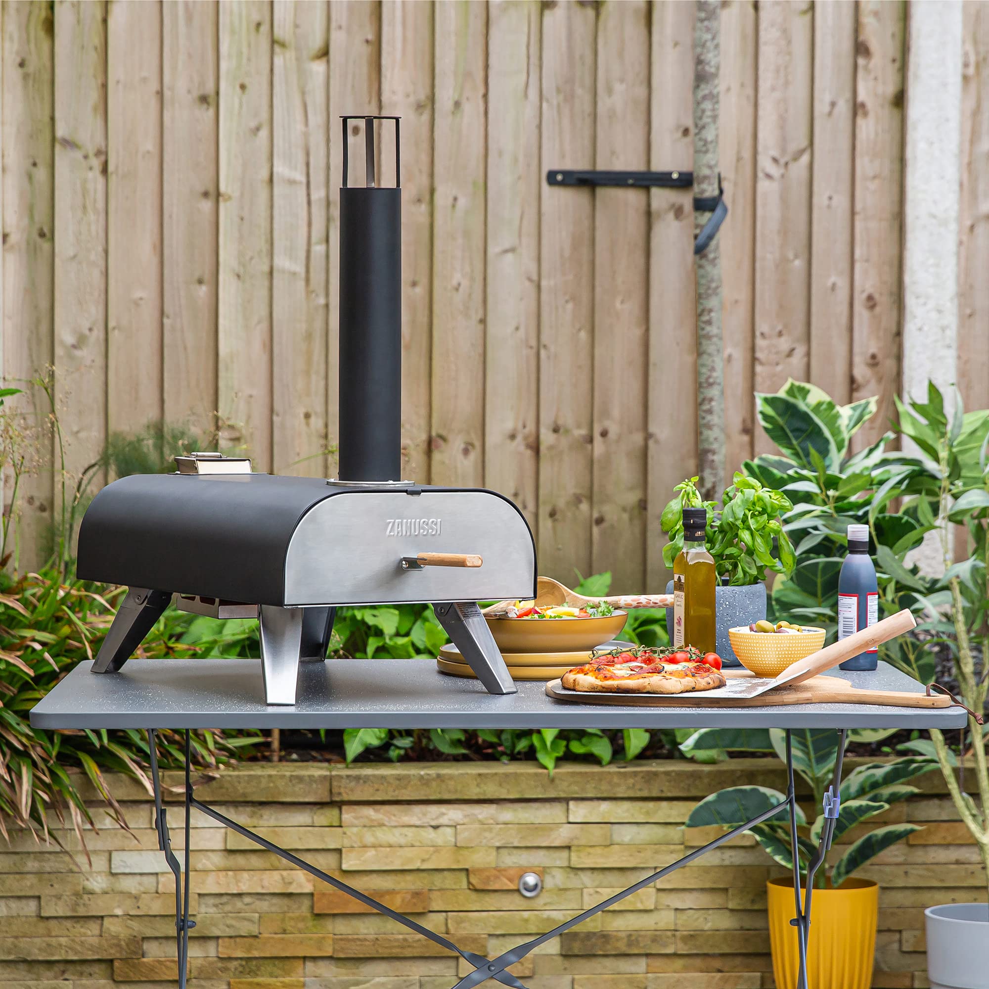 Zanussi ZPO1BPC Outdoor 12 Inch Wood Pellet Portable Wood Fired Pizza Oven with Paddle and Cover in Black, BBQ Oven & Smoker, Stainless Steel Foldable Legs