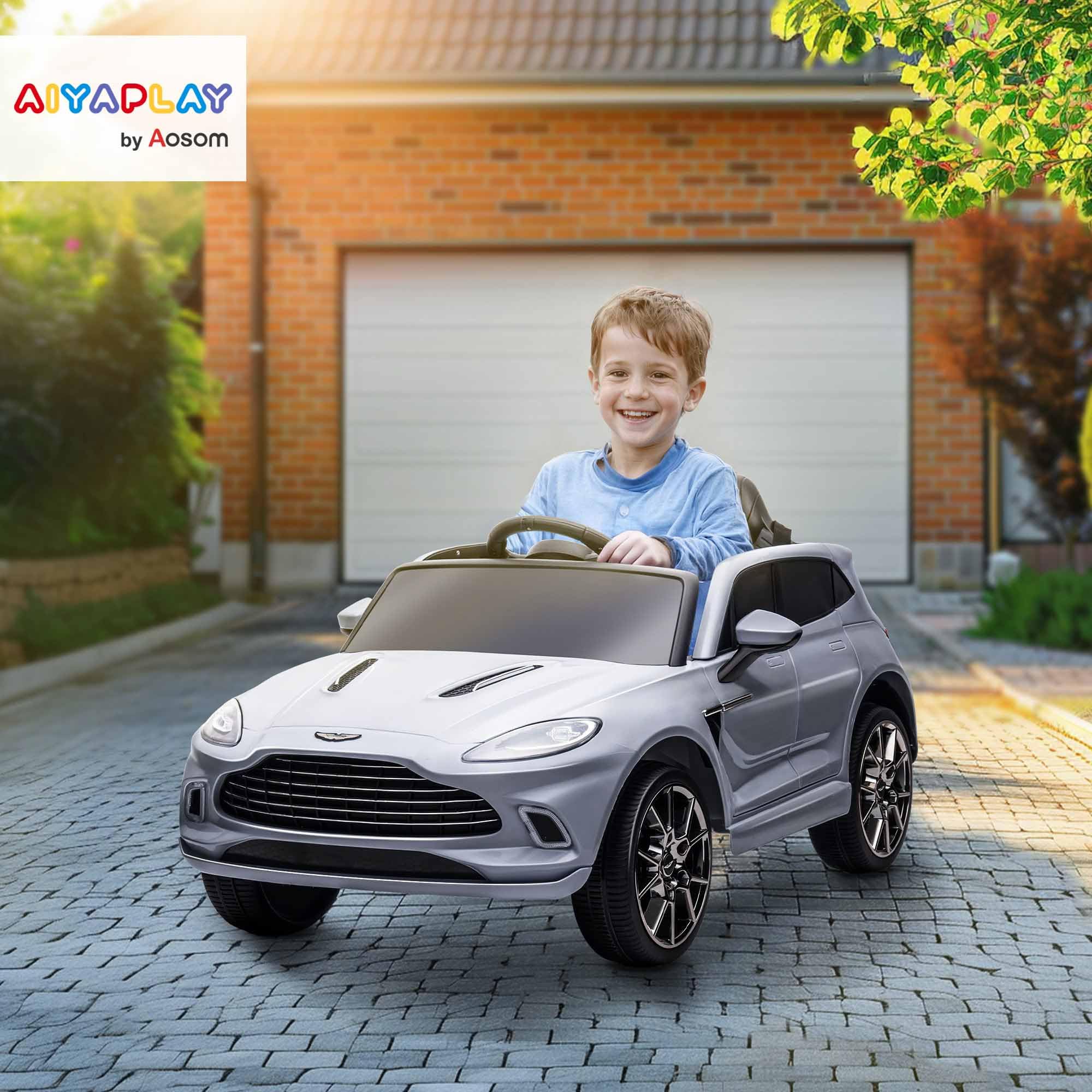 AIYAPLAY 12V Kids Electric Car, Aston Martin DBX Licensed Kids Ride on Car with Remote Control, 4 Suspension Wheels, LED Lights, Music, Horn, Slow Start, for Ages 3-6 Years, Blue