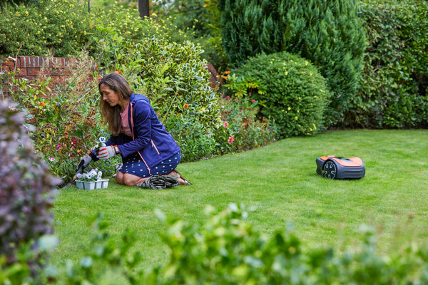 Flymo EasiLife 250 GO Robotic Lawn Mower - Cuts Up to 250 sq m, Ultra Quiet Mowing, Manicured Lawn, Bluetooth Application Control, Safety Sensors, Hose Washable, Lifestyle Functions, Orange and Grey